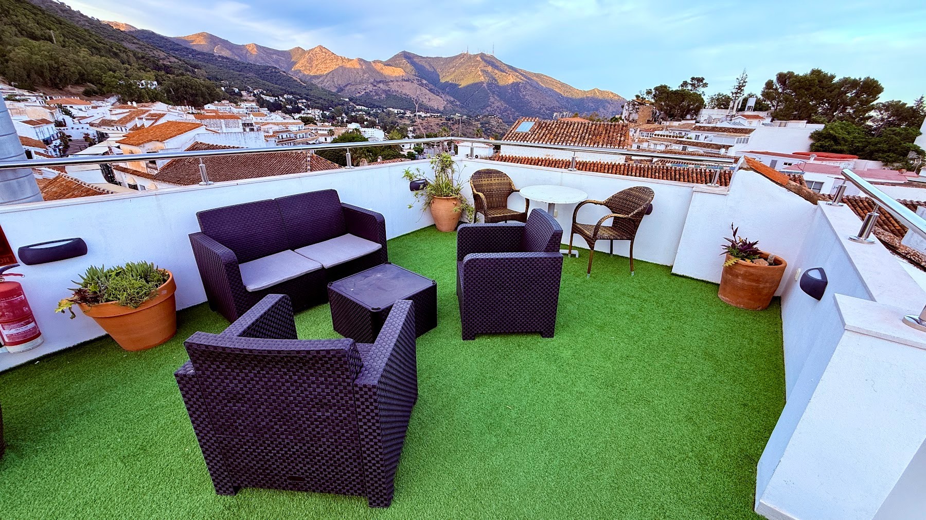Skydeck seating with golden evening light on the Sierra de Mijas
