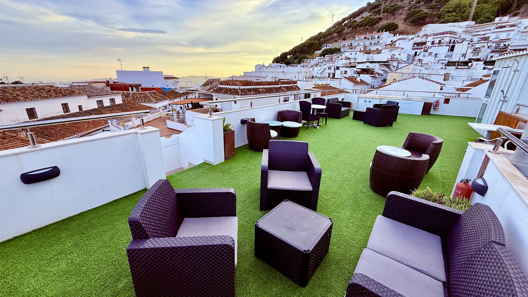 The skydeck at dusk, whitewashed Mijas houses climbing the hill behind