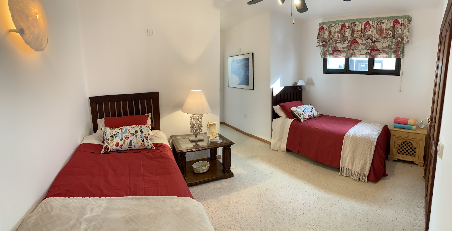 Third bedroom with twin beds and bright natural light