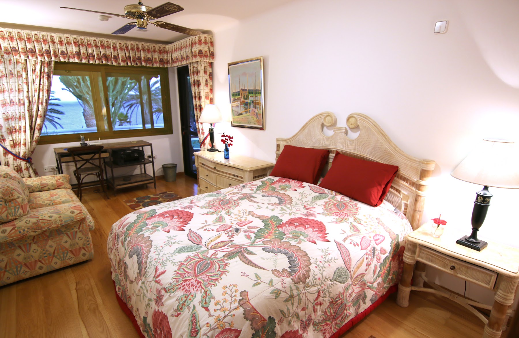 Second bedroom with garden and palm views through sliding doors